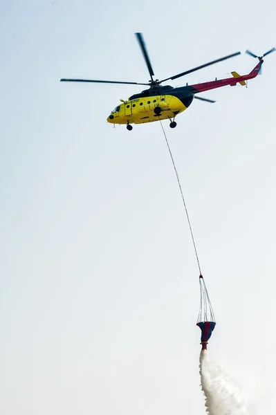 Fire rescue helicopter MI-8 wth water bucket