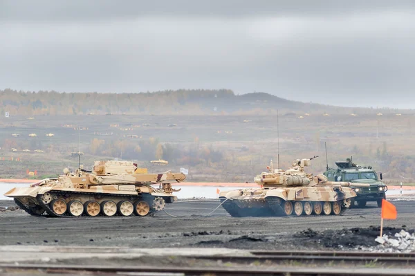 Armoured recovery vehicle BREM-1M evacuates tank