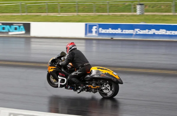 PODINGTON, UK - OCTOBER 19: An unnamed rider takes his modified Hyasbusa racing bike down the Santa Pod racew