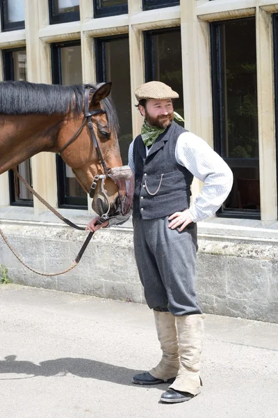 Man with horse in historical clothing
