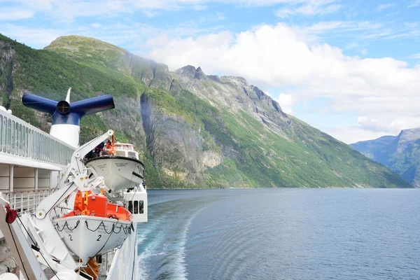 View of Geirangerfjord  Norway from rear of cruise ship turning with fjord in background