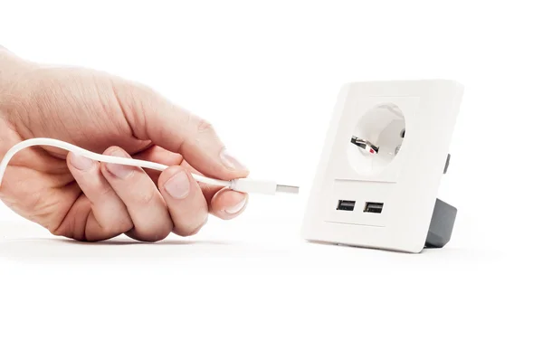 Plug in. A man stabs a usb plug into a usb port