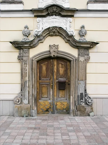 Old wooden doors of temple with columns