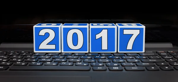 2017 year built of child\'s blocks on the laptop keyboard