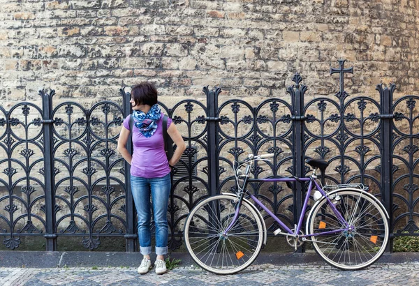 Young woman and vintage bicycle