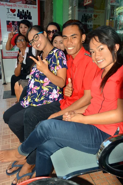 Smiling Young Staff outside their Spa Shop in Legian, Bali