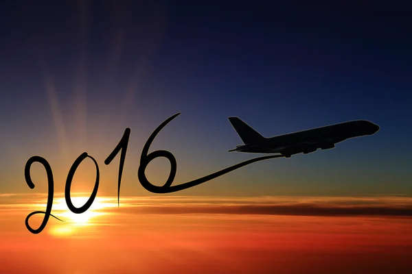 New year 2016 drawing by airplane on the air at sunset