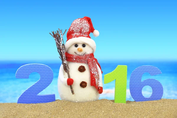 New year number 2016 and snowman on the beach