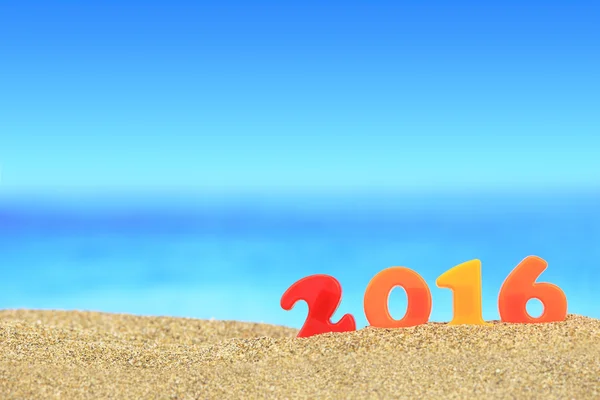 New year number 2016 on the beach