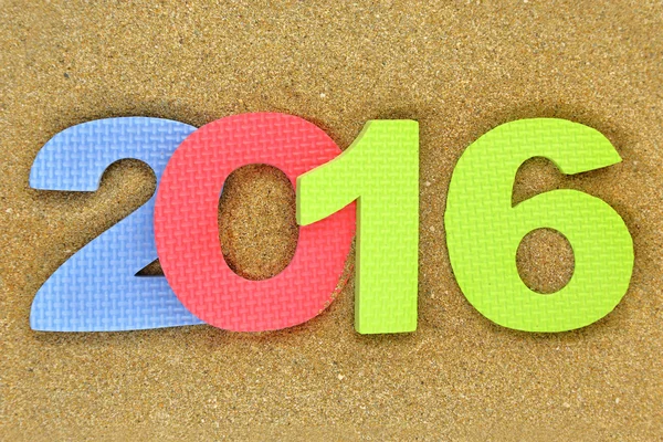 New year number 2016 on the beach