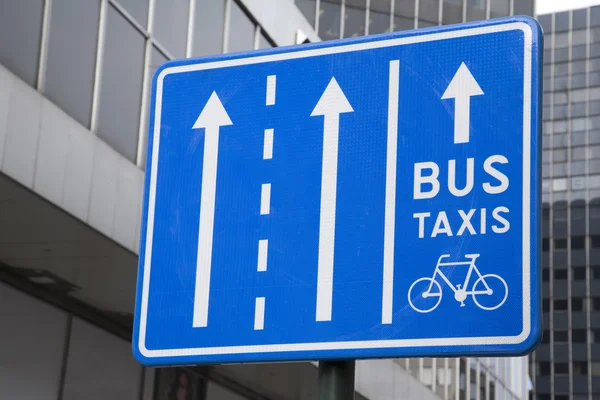 Bus, Taxi and Bicycle Sign in Urban Setting