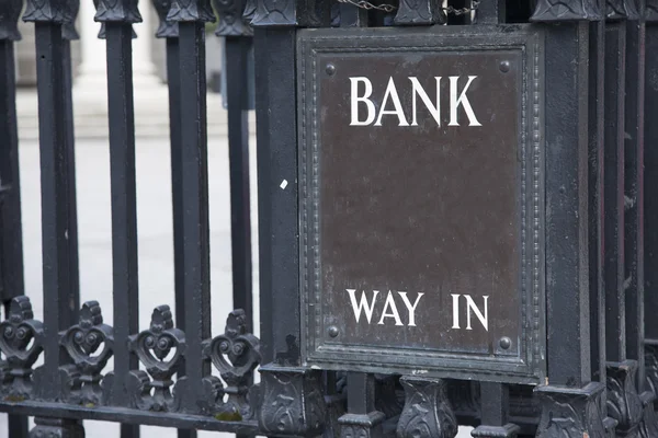 Bank Entrance Sign in Urban Setting