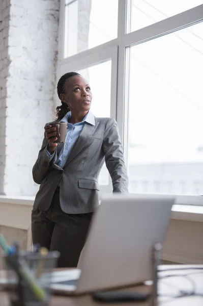 Business woman drinking coffee