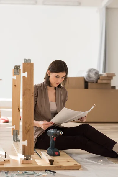 Woman Assembling Furniture