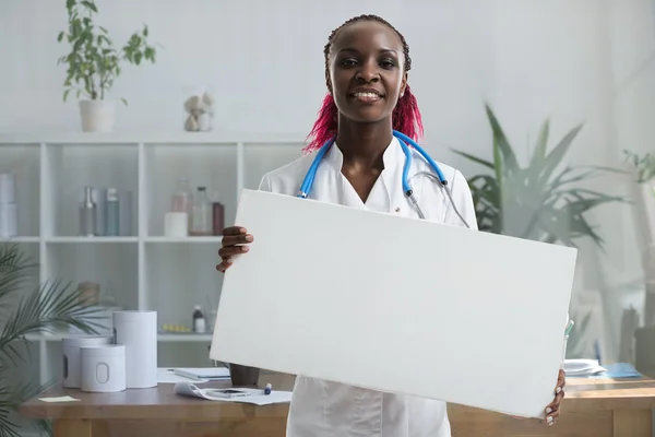 Medical doctor holding banner