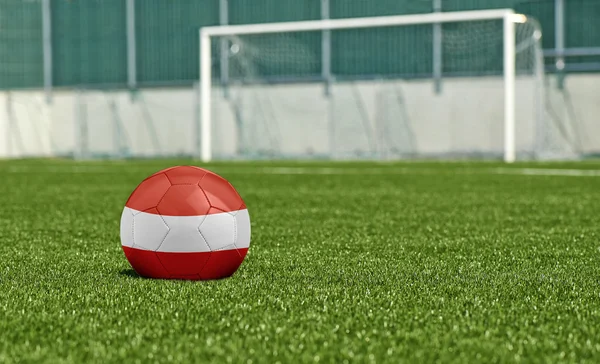 Soccer ball on the green field- flag Austria