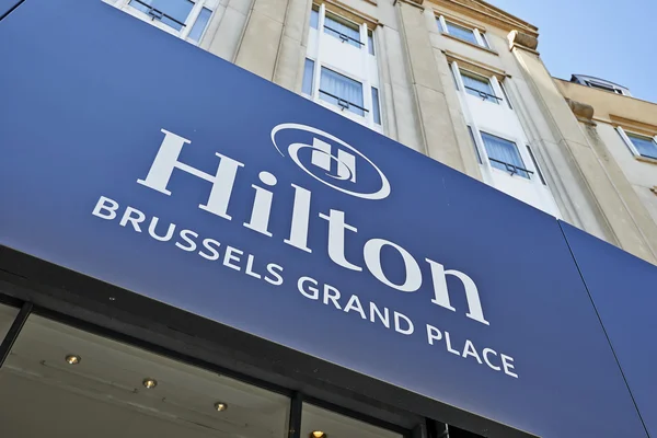 The logo above the main entrance of the Hilton Hotel