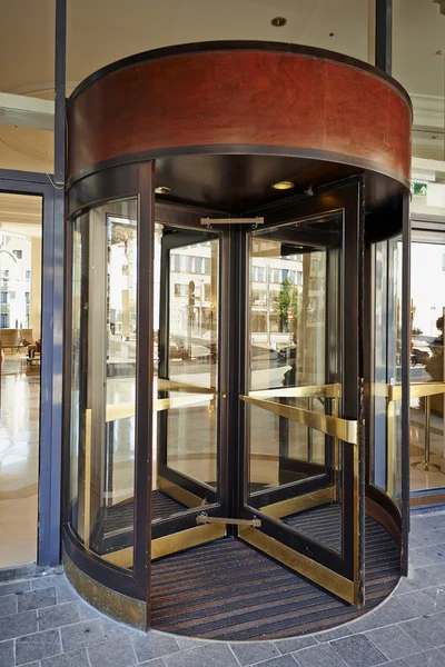 Glass revolving door at Hotel Hilton Grand Place
