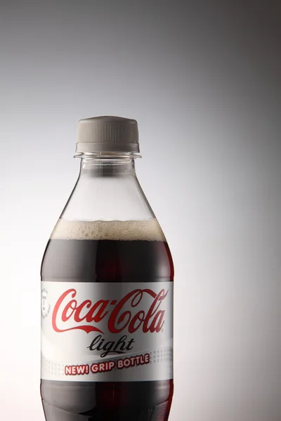 A bottle of Coca Cola drinks