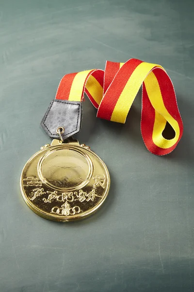 Golden medal with ribbon