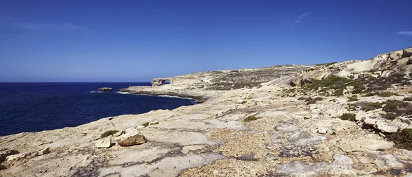 Malta Island, Gozo, Dweira, view of of the rocky coastline and the Azure Window Rock