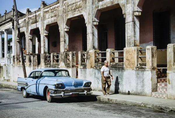 CUBA, Pinar Del Rio; 18 march 1998, old american car and a cuban man smoking a cigar in a street - EDITORIAL (FILM SCAN)