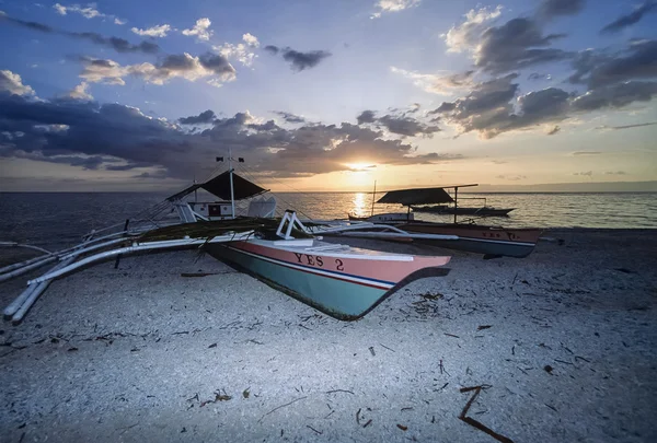 PHILIPPINES, Balicasag Island (Bohol); 24 March 2000, bancas (local wooden fishing boats) ashore at sunset - EDITORIAL (FILM SCAN)