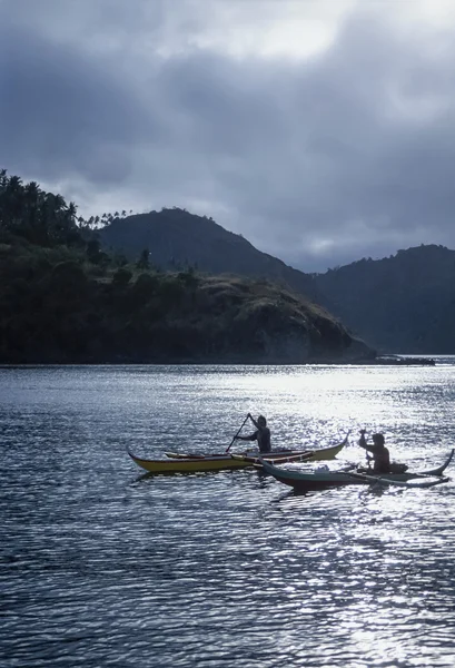 PHILIPPINES, Dakak Island; local fishermen on their wooden fishing boats - FILM SCAN