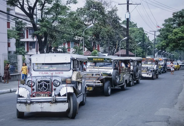 PHILIPPINES, Manila; 17 March 2000, taxi cabs (jeepneys) in a central street of the city - EDITORIAL (FILM SCAN)