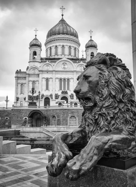 Russian church and a bronze lion sculpture