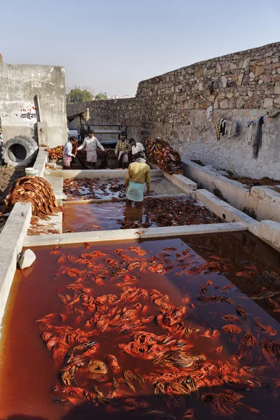 Indian people working in a fabrics factory