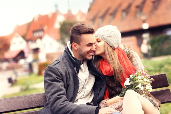 Beautiful couple kissing on a date in the city