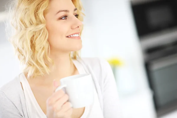 Young woman drinking coffee