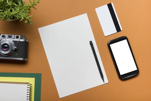 Tourism, travel concept. Office desk table with notepad, camera and supplies. Top view. Copy space for text.