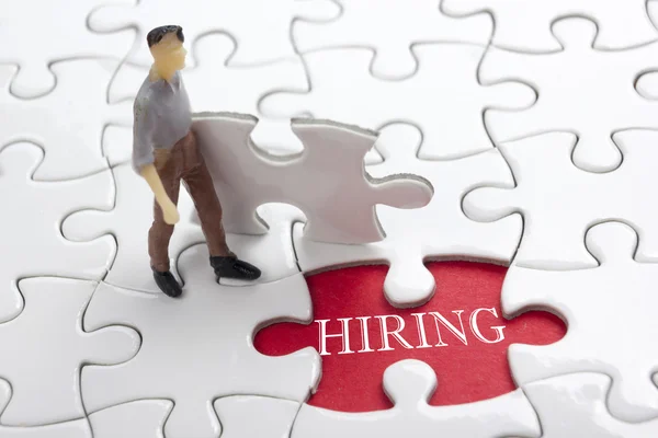 HIRING concept.  Missing Piece Jigsaw Puzzle with word