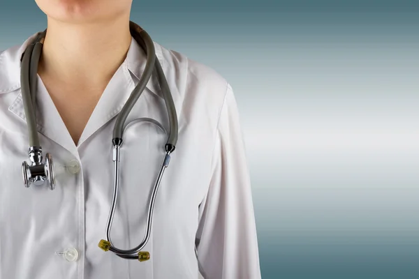 Female doctor and stethoscope on blurred background. Concept of Healthcare And Medicine. Copy space.