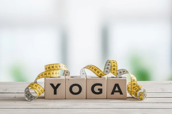 Yoga sign with measure tape