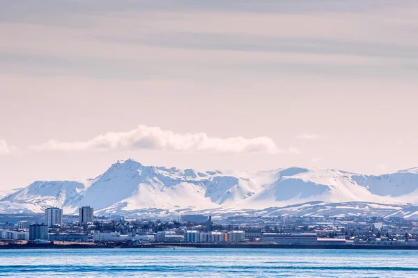 City seascape of Reykjavik with mountains in the background