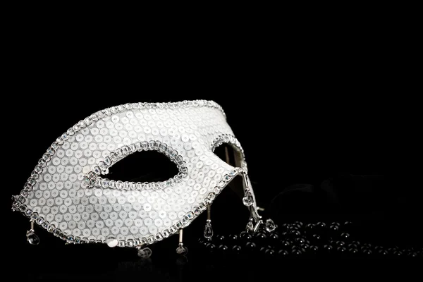 Silver glittering mask and pearls
