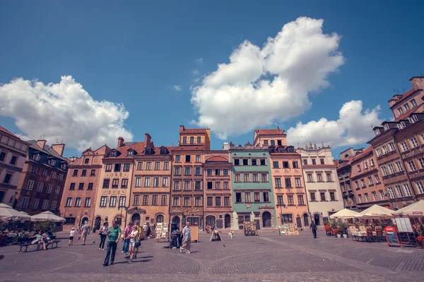 Old town marketplace square with colorful houses and outdoor cafes in Warsaw, Poland