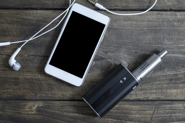 E-cigarette and phone on table