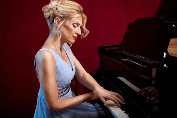 Beautiful woman musician piano music playing