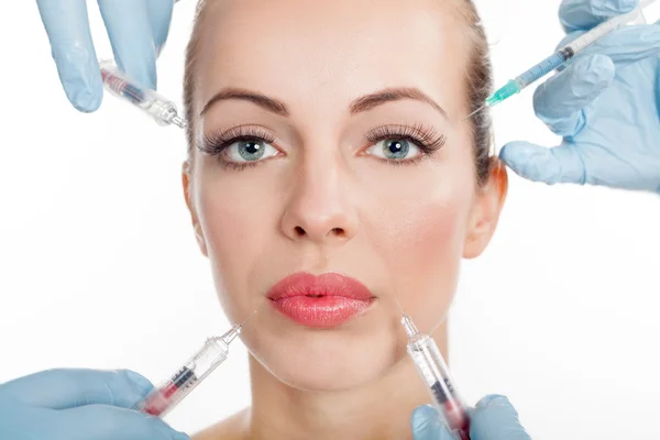Injections of botox, woman having beauty treatment