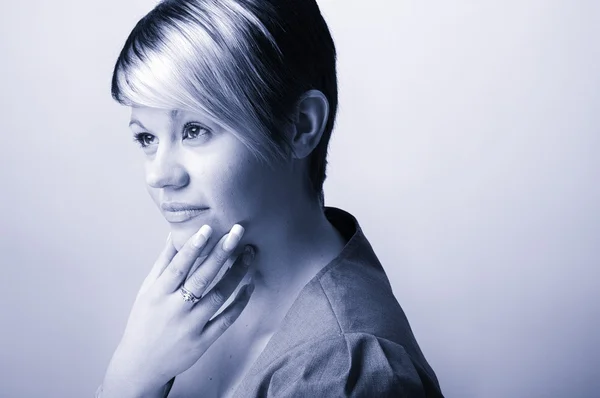 Cool blue toned  Shot of a Confident Young Office Woman . Plain