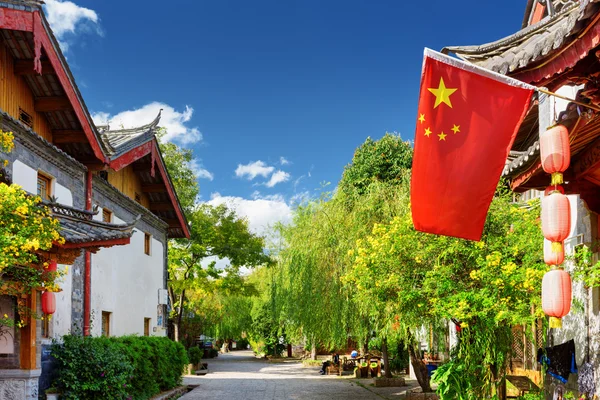 The flag of China on street in the Old Town of Lijiang, China