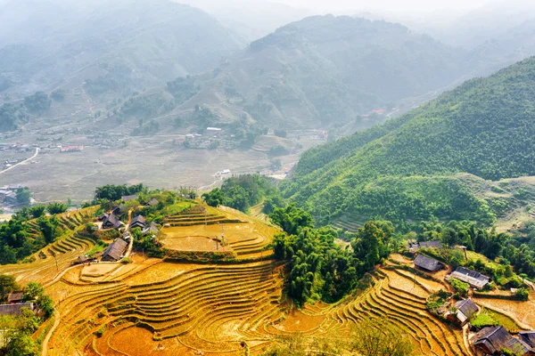 Top view of village houses and terraced rice fields at highlands