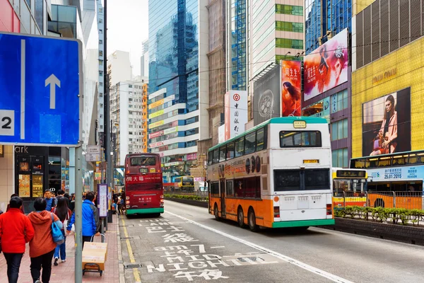 Decker buses and trams on the central streets of Hong Kong