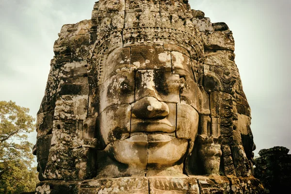 Enigmatic smiling giant stone face of Bayon temple, Angkor Thom