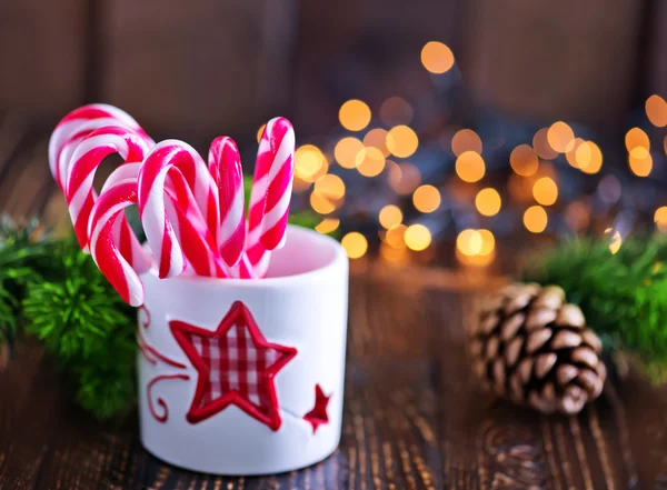 Candy canes in white glass