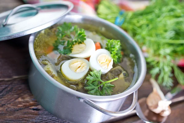 Fresh soup with boiled eggs